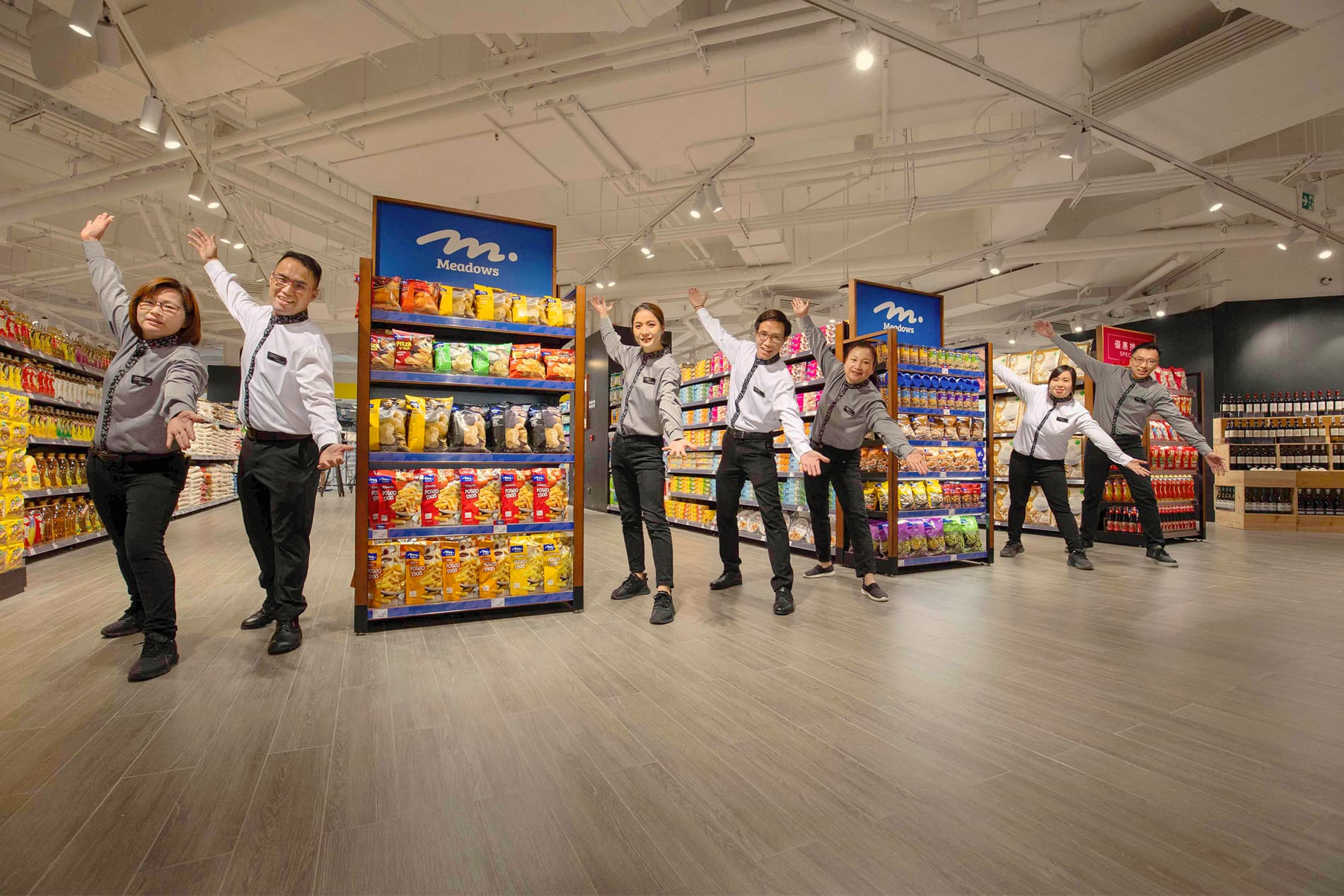 Happy team members at Meadows aisle 